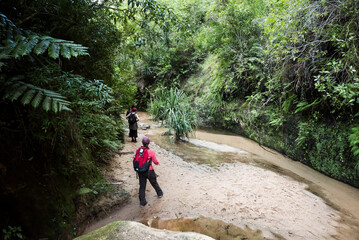 Tourists walking through a canyon in Isalo National Park, Ihorombe Region, Southwest Madagascar