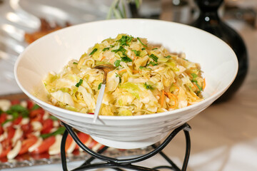 Fresh healthy salad - cabbage, carrot and olive oil