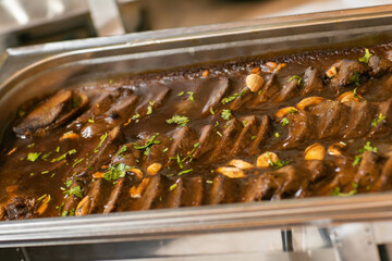 roast veal with sauce on the tray