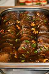 roast veal with sauce on the tray
