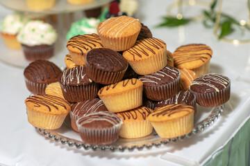 Tasty chocolate cupcakes on stand, closeup.