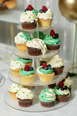 Tasty sweet cupcake on stand, closeup.