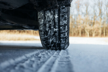 Car tires in shogo. Wheel tracks in the snow in winter