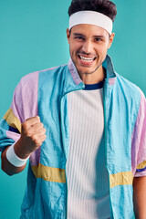 My style is what helps me to get all the girls. Cropped shot of a handsome young man styled in 80s fashion. © Emil L/peopleimages.com