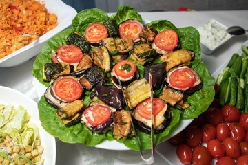 Fried eggplants in a frying pan.
