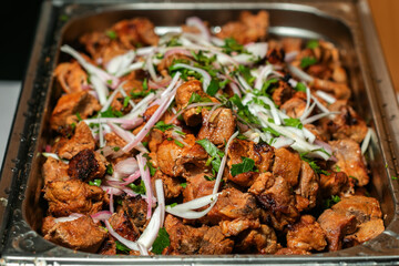 Fried grilled pork chops with caramelized onions