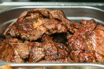 Grilled beef steak in sauce on a tray