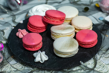 Macaroons. Delicious french desserts. Macaroons with raspberries and cream cheese. Macaroons on the table