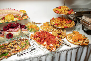 Many different dishes with fish and seafood.