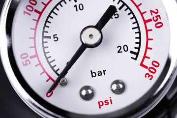 air compressor with bar and psi manometer close-up macro. Pressure gauge measurement.