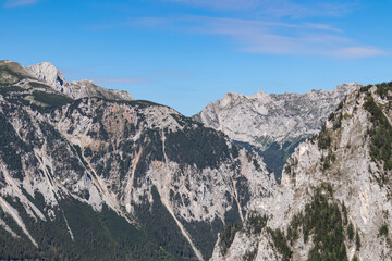 A panoramic view on the Alpine mountain chains in Styria,Austria,Hochschwab region.The slopes are partially overgrown with bushes,higher parts baren. A sunny day.Serenity,Wanderlust.Hiking in Alps