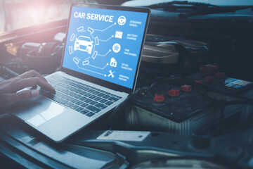 Mechanic with laptop near car engine. Modern car diagnostic program on screen. Car service concept.