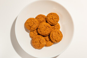 Cookies,Biscuits on white plate top view on white background.