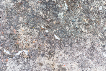 Cracked concrete wall gray cement surface background.cracked grey stone wall in winter.close-up.