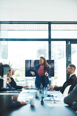 Thats right. Cropped shot of an attractive young businesswoman giving a presentation in the...