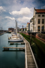 Fototapeta premium Sailing ships lie still along a pier in the port of Vlissingen in the Netherlands