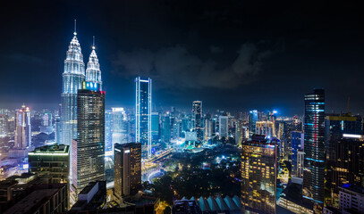 Panorama aerial night view of Kuala Lumpur city skyline. Malaysia. Blue mode