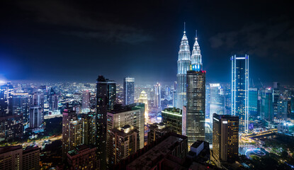 Naklejka premium Panorama aerial night view of Kuala Lumpur city skyline. Malaysia. Blue mode
