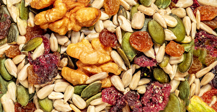 Nuts, seeds and dried fruits as a  background. Flat lay. Top view. Pattern