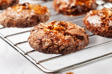 Homemade cookies on a metal grill on a gray background