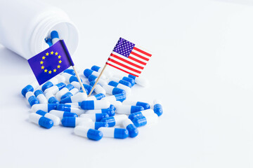 Fototapeta na wymiar Pills and EU and USA flag. Import of tablets to the USA