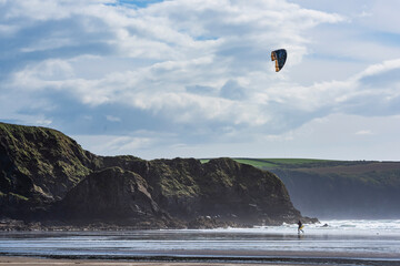 Kitesurfer on Broadhaven Beach, Pembrokeshire Coast National Park, Wales, United Kingdom