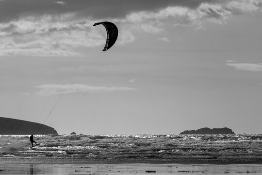 Kitesurfer on Broadhaven Beach, Pembrokeshire Coast National Park, Wales, United Kingdom