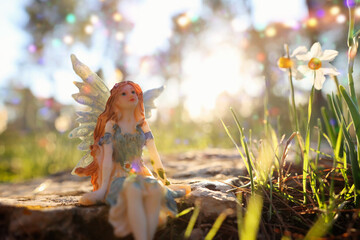 image of magical little fairy in the forest at sunset