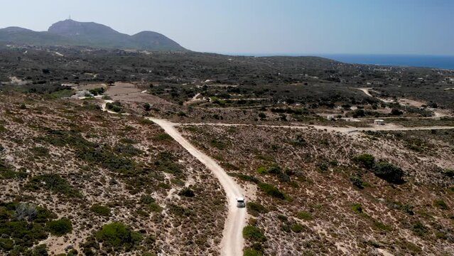 Aerial view of a car driving on a dirt road on Kos island