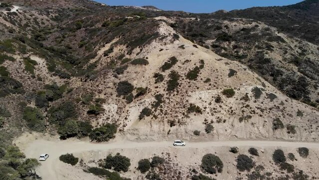 Aerial view of a car driving on a dirt road on Kos island