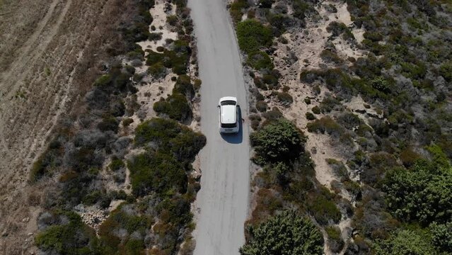 Aerial view of a car driving on a country road on Kos island