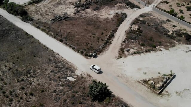 Aerial view of a car driving on a country road on Kos island
