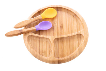 Wooden bowl. Bamboo plate with spoon isolated on white background