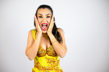 Young beautiful woman wearing carnival costume over isolated white background crazy and scared with hands on head, afraid and surprised of shock