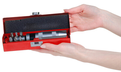 Hand holding impact screwdriver in box on white background isolation