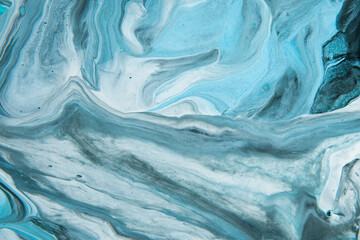 Painting on canvas. Modern art. Mixing paints. Fluid Art.