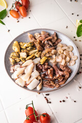 selective focus. raw seafood sea cocktail. mussel meat, squid, octopus, shrimp. spread out on a plate