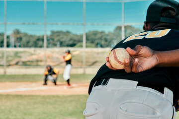 My team game to win. Rearview shot of a baseball player holding the ball behind his back. - obrazy, fototapety, plakaty