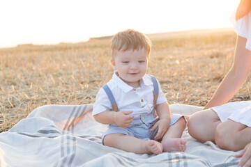 Fototapeta premium Mother and her son on holiday at a picnic.