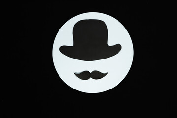 Male silhouette in a hat on a white background