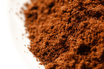Macro Ground coffee. Texture of coffee, close up on white background