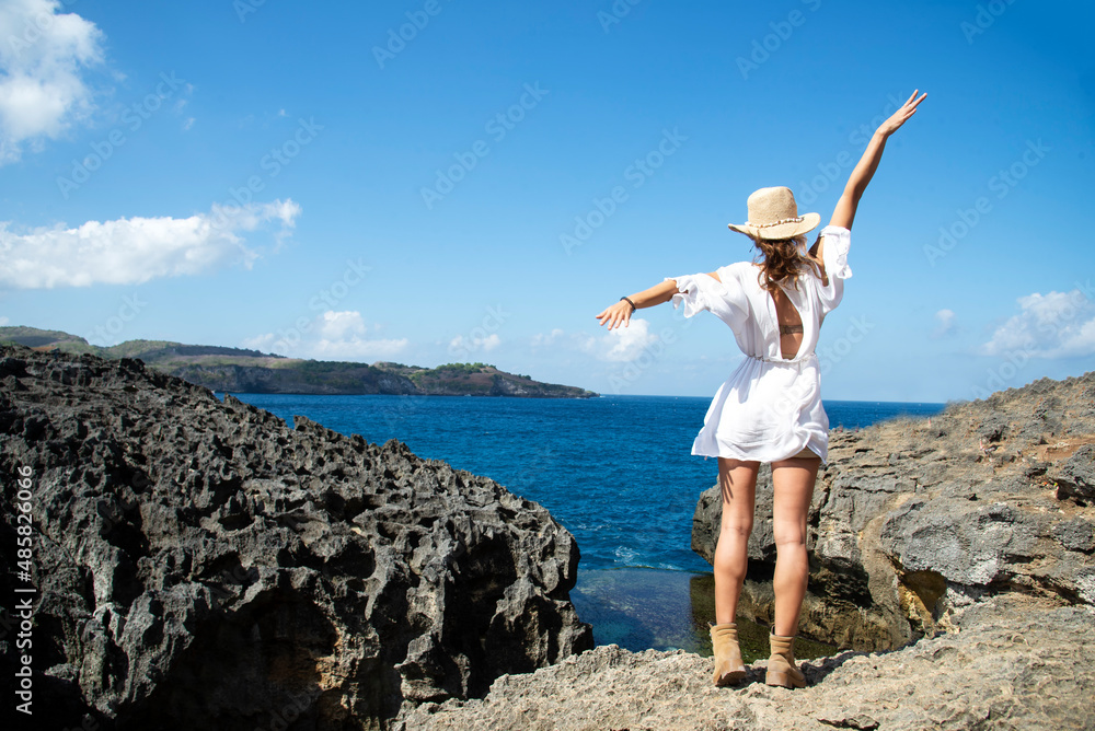 Wall mural happy traveler and tourism young women travel summer on the beach. relax outdoor destination leisure