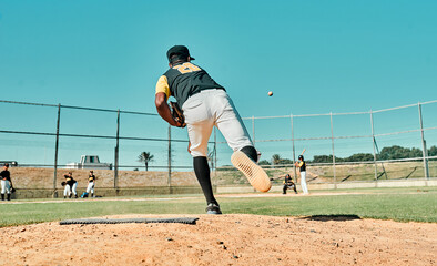 He throws nothing but fast pitches. Shot of a young baseball player pitching the ball during a game...