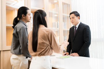 Good looking Asian businessman Meeting with employees at the company concept finance marketing credit.
