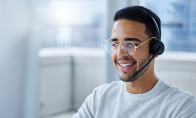 Today is a great day to be productive. Shot of a young businessman working at his desk in his...