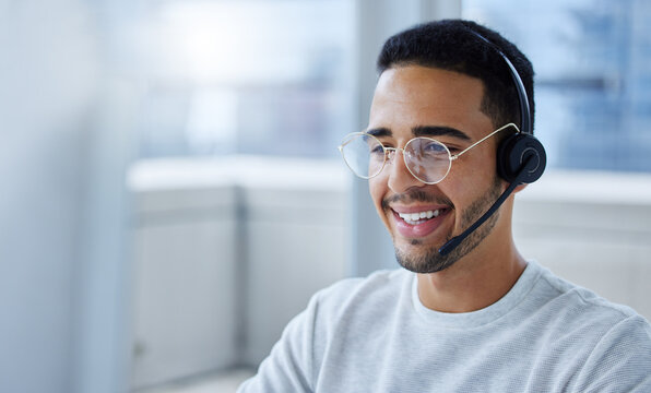 Today Is A Great Day To Be Productive. Shot Of A Young Businessman Working At His Desk In His Office.