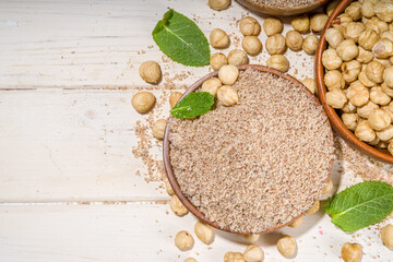 Alternative keto diet gluten grain free flour. Paleo and ketogenic diet baking cooking concept. Hazelnut flour with whole nuts