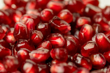 Macro of peeled ripe seeds pomegranate isolated.