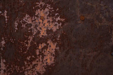 Rusty iron. The texture of the old rusty metal sheet. Closeup.