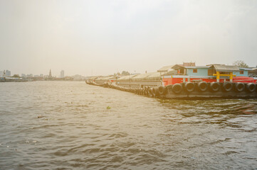Sand barges along Chao Phraya river, Bangkok, Thailand